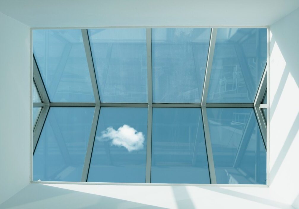 Cloud visible through a glass ceiling grid.